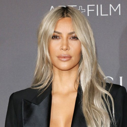 Kim Kardashian Paired Her Itty Bitty Black Bikini With A Gold Belly