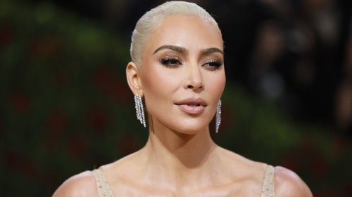 Kim Kardashian Wore A Nude String Bikini And Thigh High Boots To The