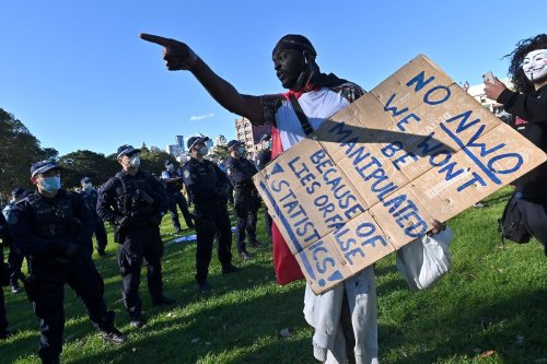 Protesters clash with police as thousands march against Australia lockdown