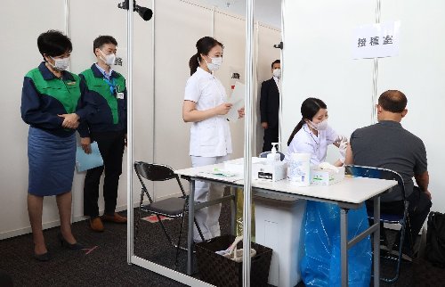 Olympic staff, volunteers vaccinated as Tokyo Games near
