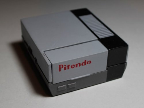 Relive your favorite classic video games with the pocket sized Pitendo NES emulator