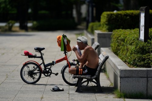 Extreme heat and tropical rainfall pound China and Japan