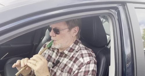 Henry Frantz plays recorder waiting for son to vote.