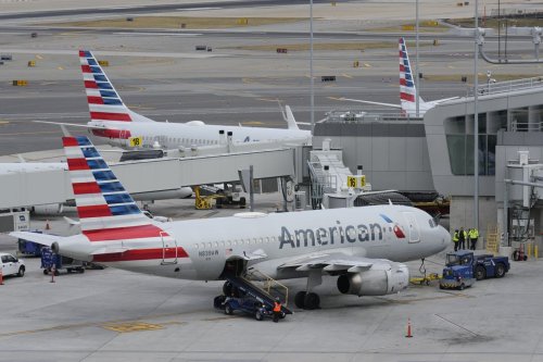 American Airlines passengers duct tape man trying to open emergency exit door