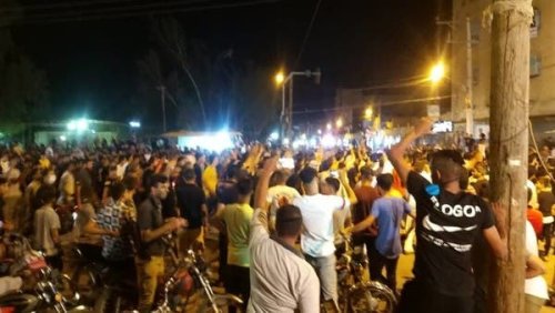 Demonstrators in Isfahan torch Khamenei banner as Iran protests continue