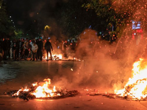Greek authorities call for calm after unrest over police shooting