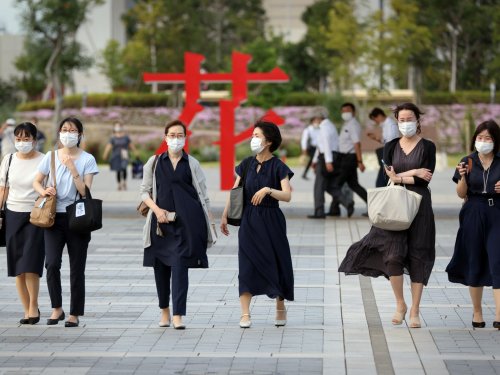 Officials sound alarm as Japan COVID cases hit record highs