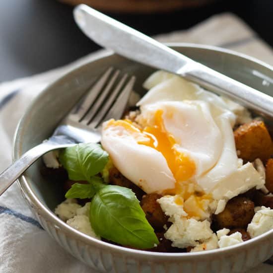 Fried Potatoes Breakfast Bowl with Feta Cheese & Poached Egg