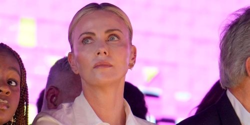 Charlize Theron’s Dimpled Daughter, 7, Flaunts $3,400 Purse Sitting Front Row at a Fashion Show, Sparking Talks