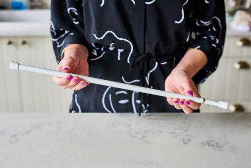 A Surprising (and Very Smart!) Way to Use a Tension Rod in Your Kitchen