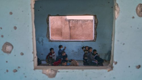 Photos show Syrian students returning to schools stripped bare by conflict