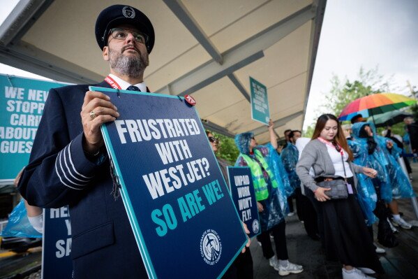 Flight attendants at Canada's WestJet go on strike in dispute over pay