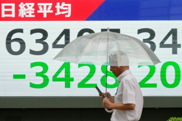 Asian shares sink, with Tokyo down more than 5% as slumping AI stocks drag world markets lower