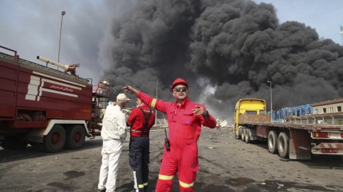 A massive explosion at an Iranian port linked to missile fuel shipment kills 14, injures some 750