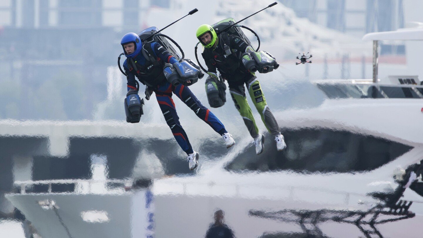 ‘Iron Man’ pilots race in jet suits against a backdrop of Dubai skyscrapers