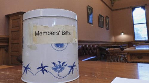 In New Zealand's Parliament, a battered cookie tin decides which new laws get debated