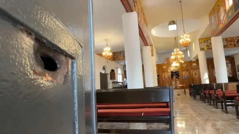 Image from AP's coverage: Survivor of deadly attack on Jordan church describes people crawling for their lives
