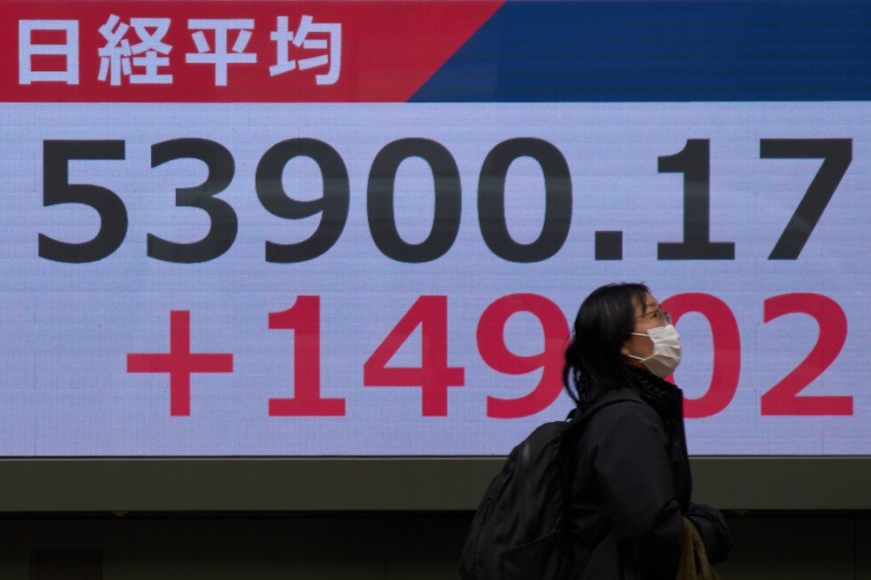 Asian shares are mixed and US futures slip as Brent hovers at over $100 a barrel