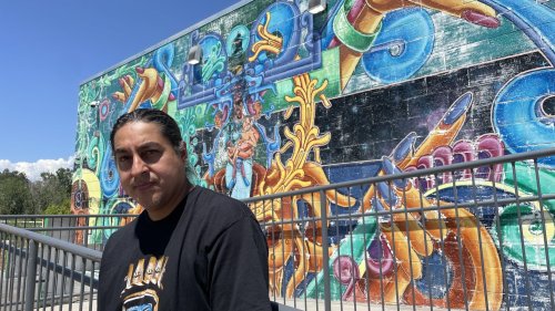 A neighborhood mural is restored in Denver