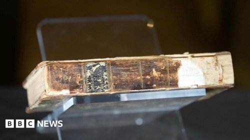 Who was the murderer whose skin binds a book?