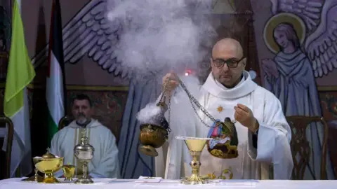 We're orphans now, say Gaza Catholics the Pope called daily