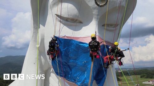 Giant Buddhist statue gets Covid face mask