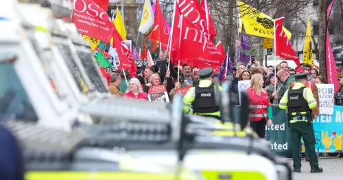 Large crowds at Belfast City Hall anti-immigration protest and counter-rally