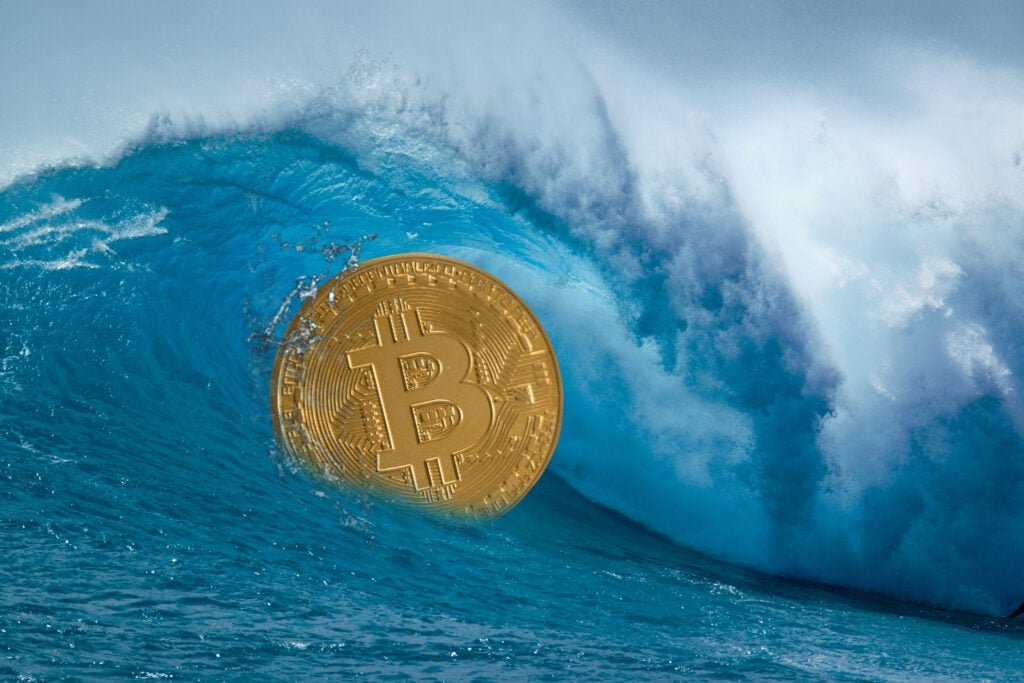 Bitcoin Drops Below $77,000, Ethereum, XRP, Dogecoin Slide Up To 4% On Cascade Fears