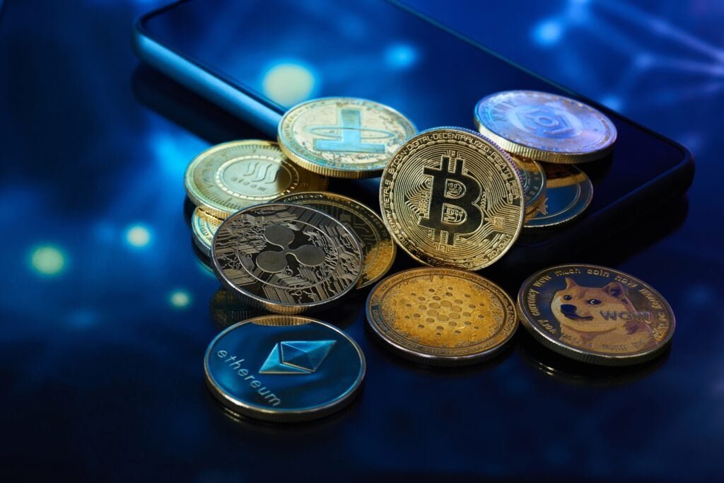 Bitcoin Plunges Below $77,000, Ethereum, XRP, Dogecoin Slide 3% In Overnight Crash