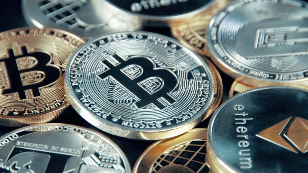 Bitcoin, Ethereum, XRP, Dogecoin Hold Gains As Fed Rate Cut Odds Surge