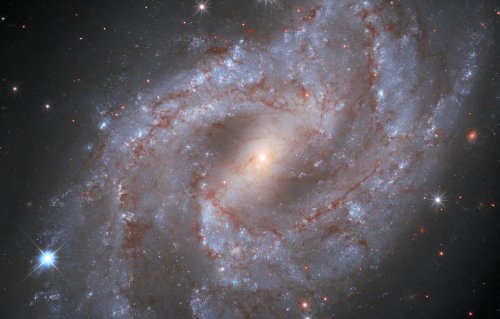 A star exploded in a distant galaxy, and Hubble spotted it