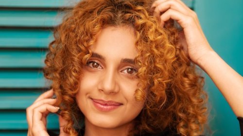 Why did humans evolve curly scalp hair?