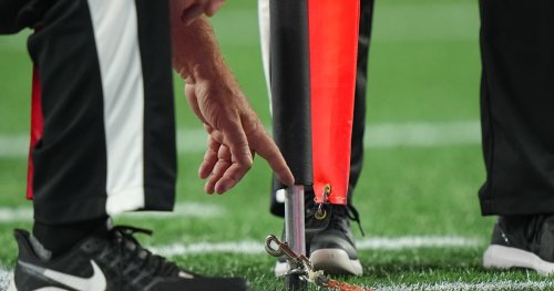 NFL Official Carted Off After Gruesome Leg Injury from Collision with Saints' Kamara