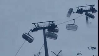 Italien: Windböen schütteln Skifahrer auf Sesselliften durch