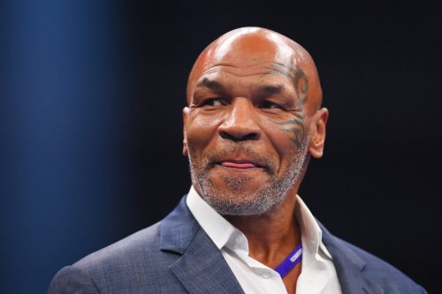 Mike Tyson watches in awe as fan emulates his aggressive style on heavy bag