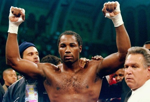Lennox Lewis narrowly escaped defeat in slugfest to set up revenge fight against rival
