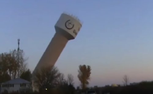 Water tower collapse caught on video, narrowly misses house