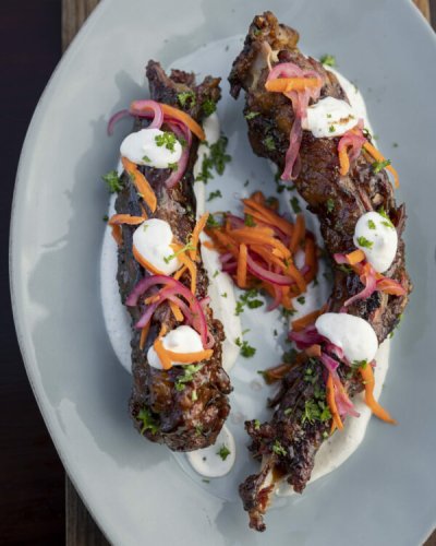 WHOLE BRAAIED OXTAIL WITH PICKEL AND YOGURT SAUCE