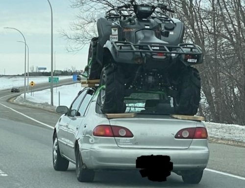 Driver spotted north of Twin Cities hauling ATV on top of sedan