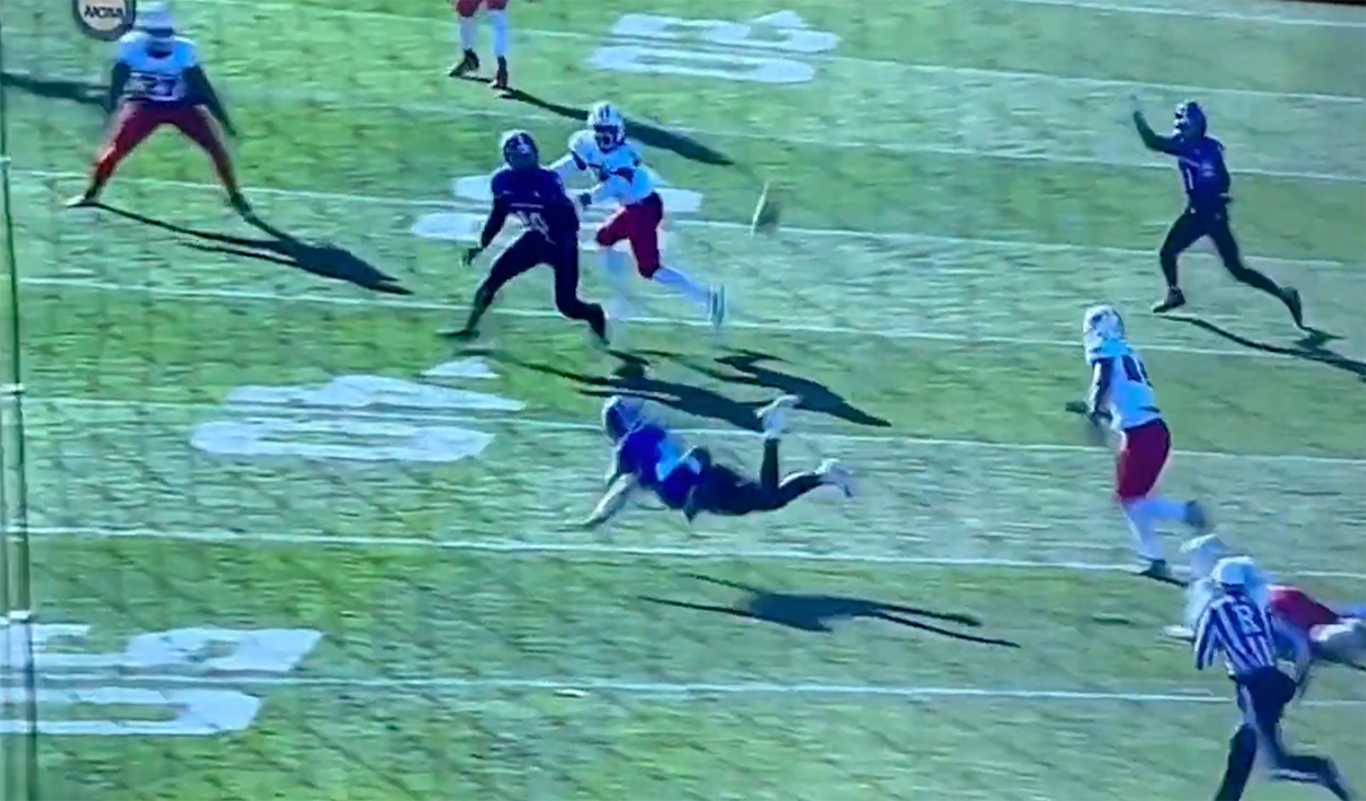 Holy Cross Quarterback Completes Absolutely Insane Underhand Pass While Going Flying (Video)