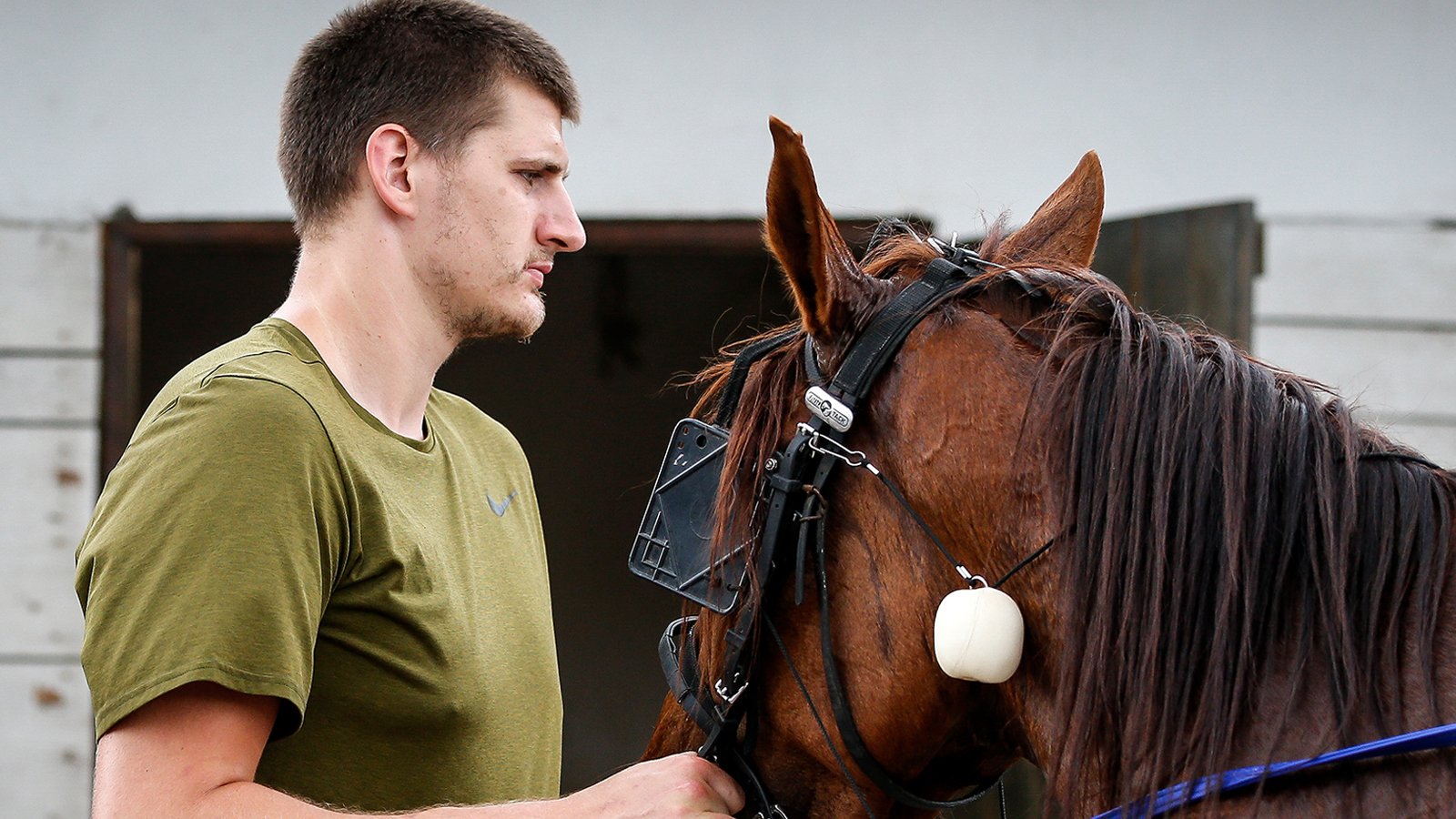 Video Of Nikola Jokic Scouting Horses On His Phone During Practice Proves The NBA Is Really Just His Side Hustle