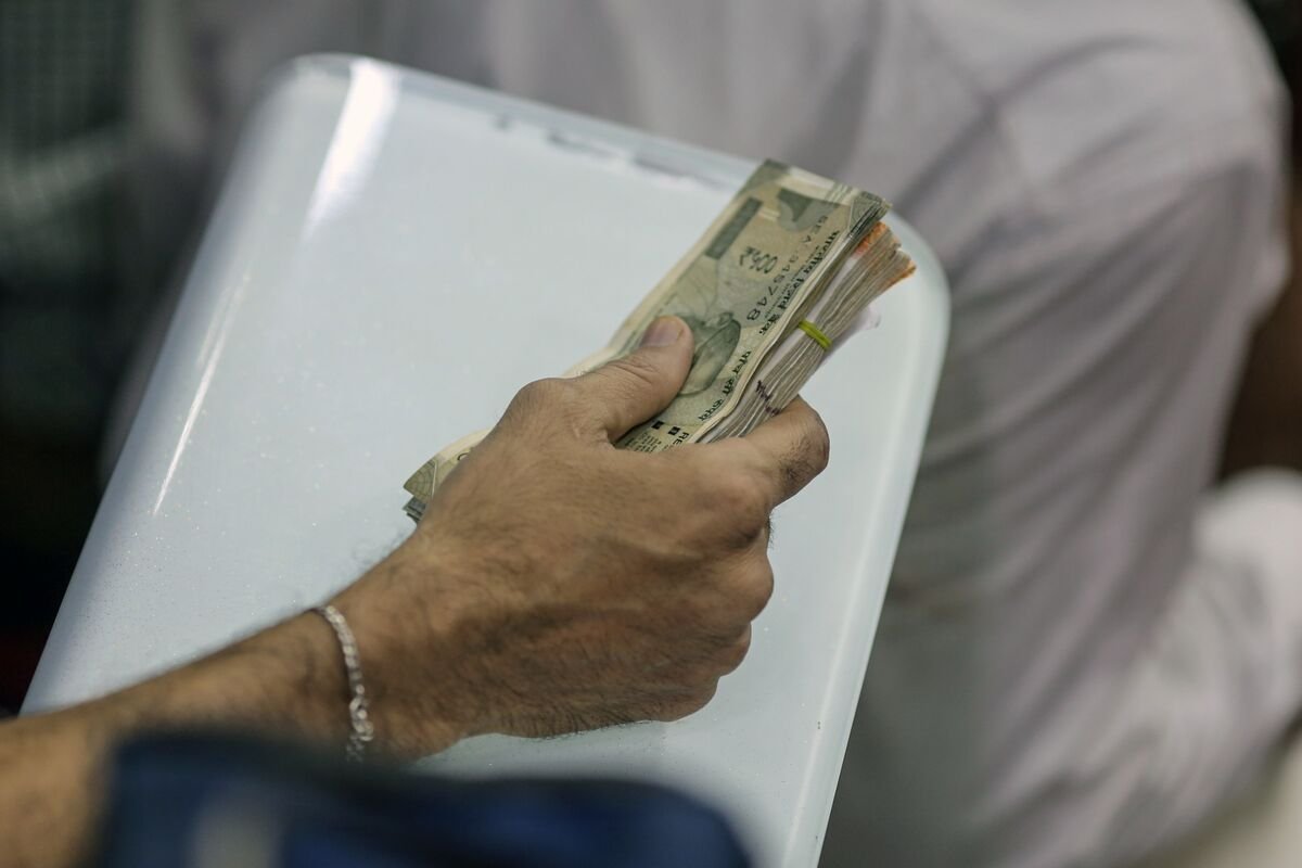 India’s Rupee Slides to Record on Importer Dollar Purchases