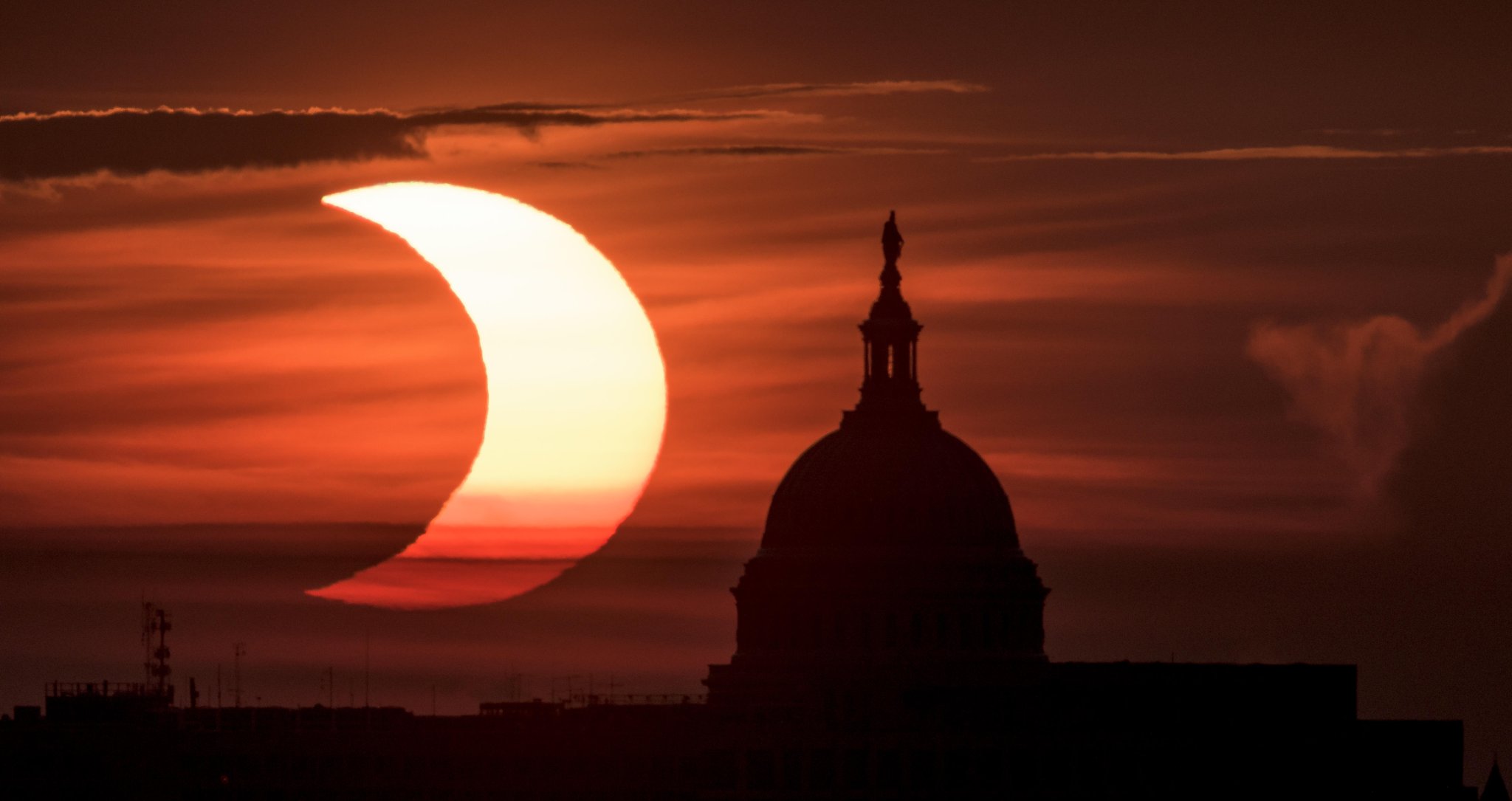 Rare "ring of fire" solar eclipse captured in spectacular photos from around the world