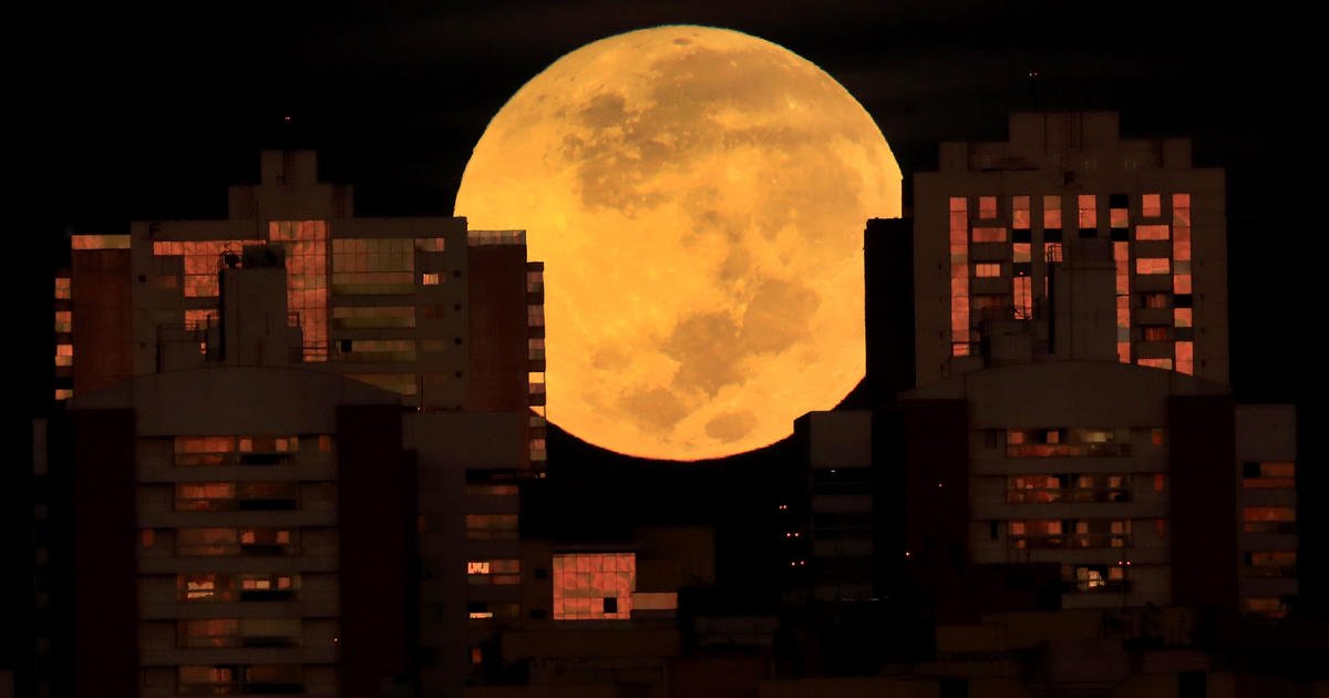 Rare "super flower blood moon" lunar eclipse captured in stunning photos from around the world