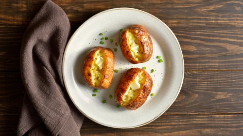 This Meaty Topping Makes Baked Potatoes More Than A Side Dish