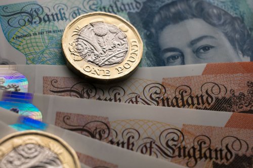 Rates on UK debt surge higher and pound slumps against US dollar