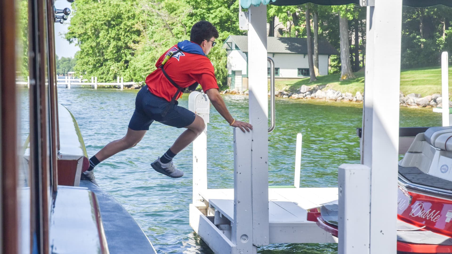 'The coolest summer job': These teens jump off a moving boat to deliver mail in Wisconsin