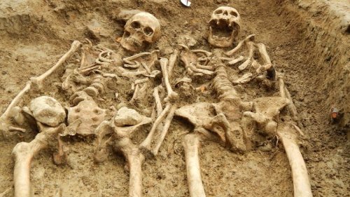 Skeletons found 'holding hands' after 700 years