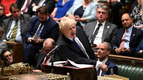 Boris Johnson clings to power after dozens of British lawmakers resign and urge him to quit