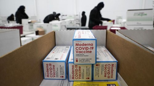 The Moderna vaccine is now in some Americans' arms as Covid-19 cases in the US pass 18 million